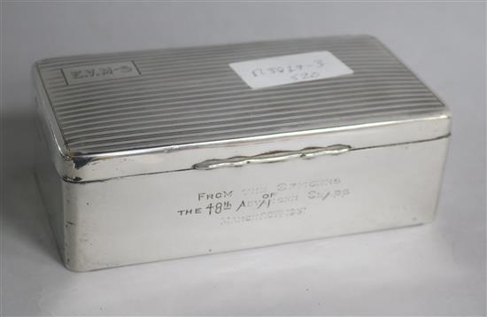 A late 1920s engine turned silver cigarette box, 17cm.